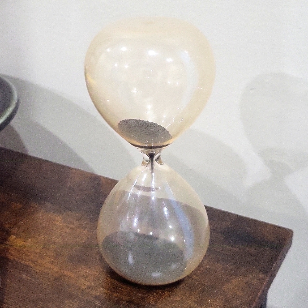 Vintage hourglass black sand